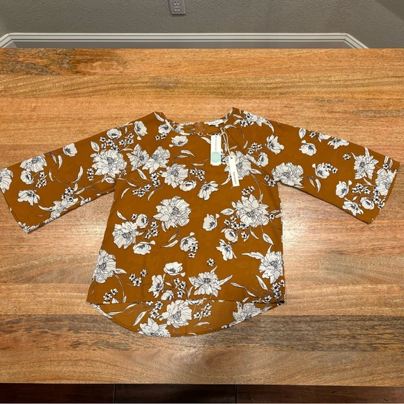 Crescent Tops - Brown, Cream and Black floral print blouse with a zipper in the back.